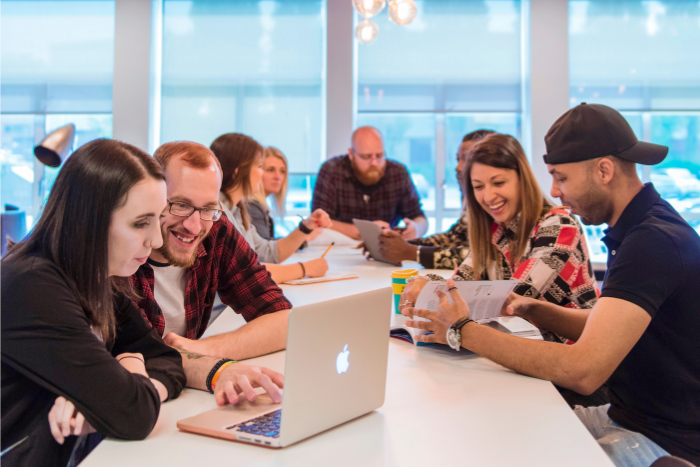 A group of Wrexham University Students work and socialise in 'The Study' one of Wrexham University's many breakout rooms across the campus.