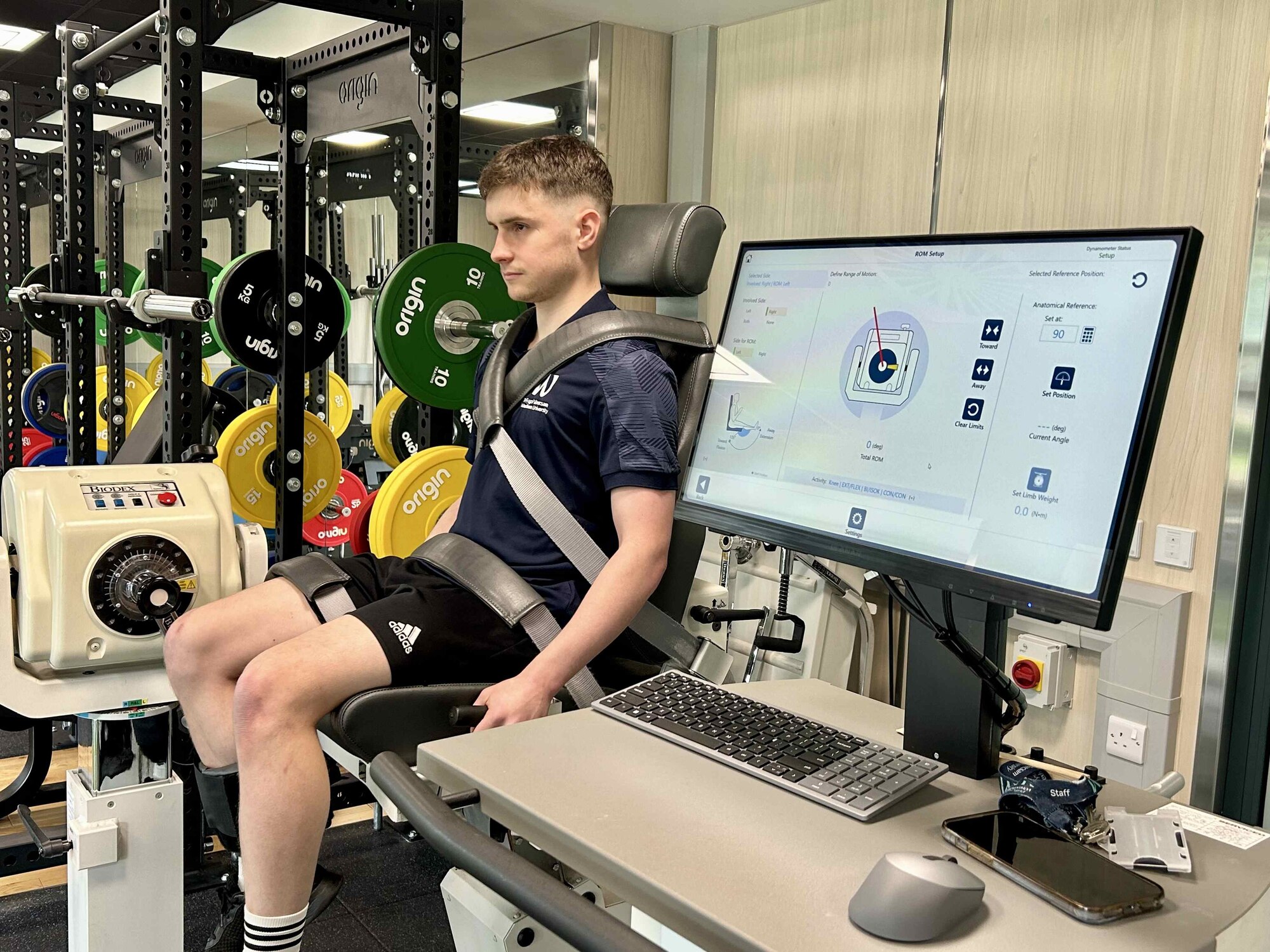 A student sitting on biomechanics lab equipment