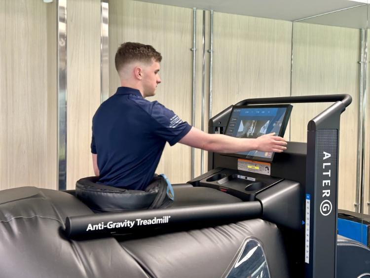 A student using an advanced treadmill