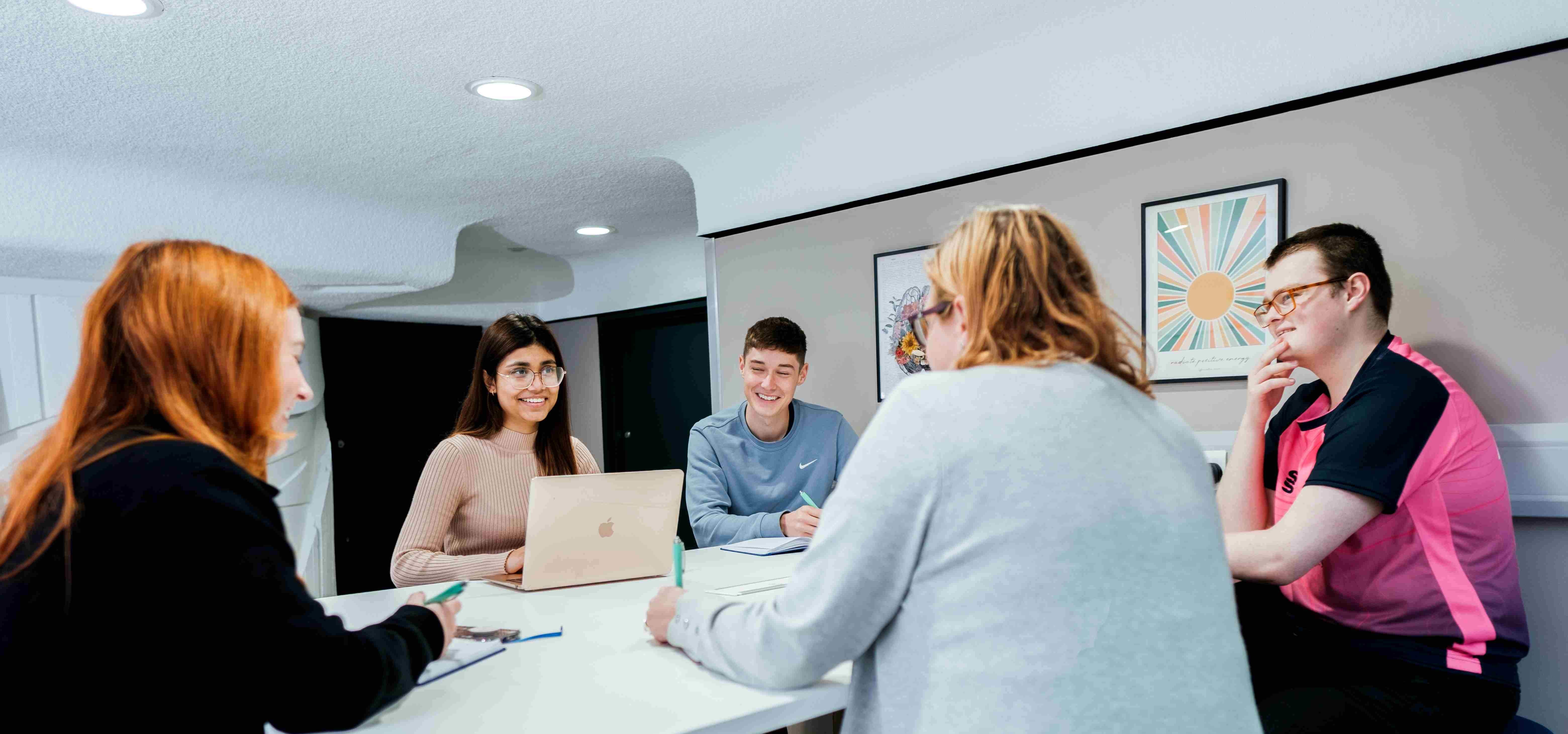 Students sitting around a table
