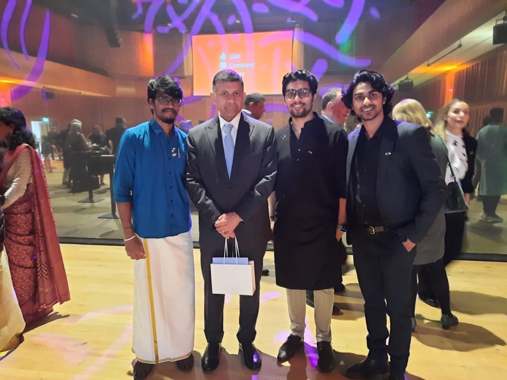 A student joined with three others at a Diwali event