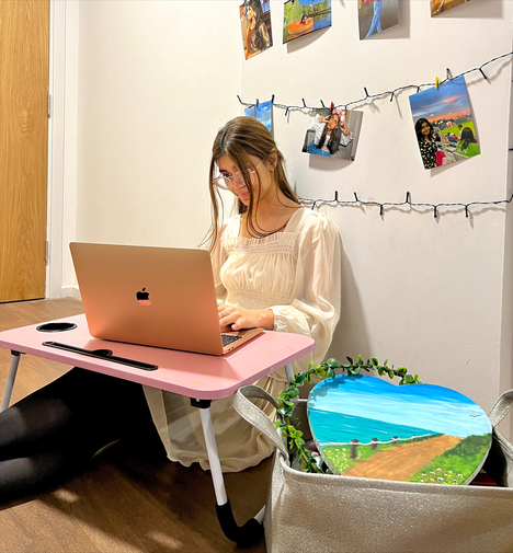 Student sitting with laptop