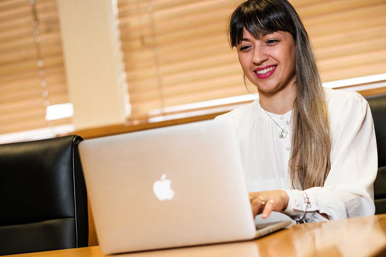 Person sat on a laptop