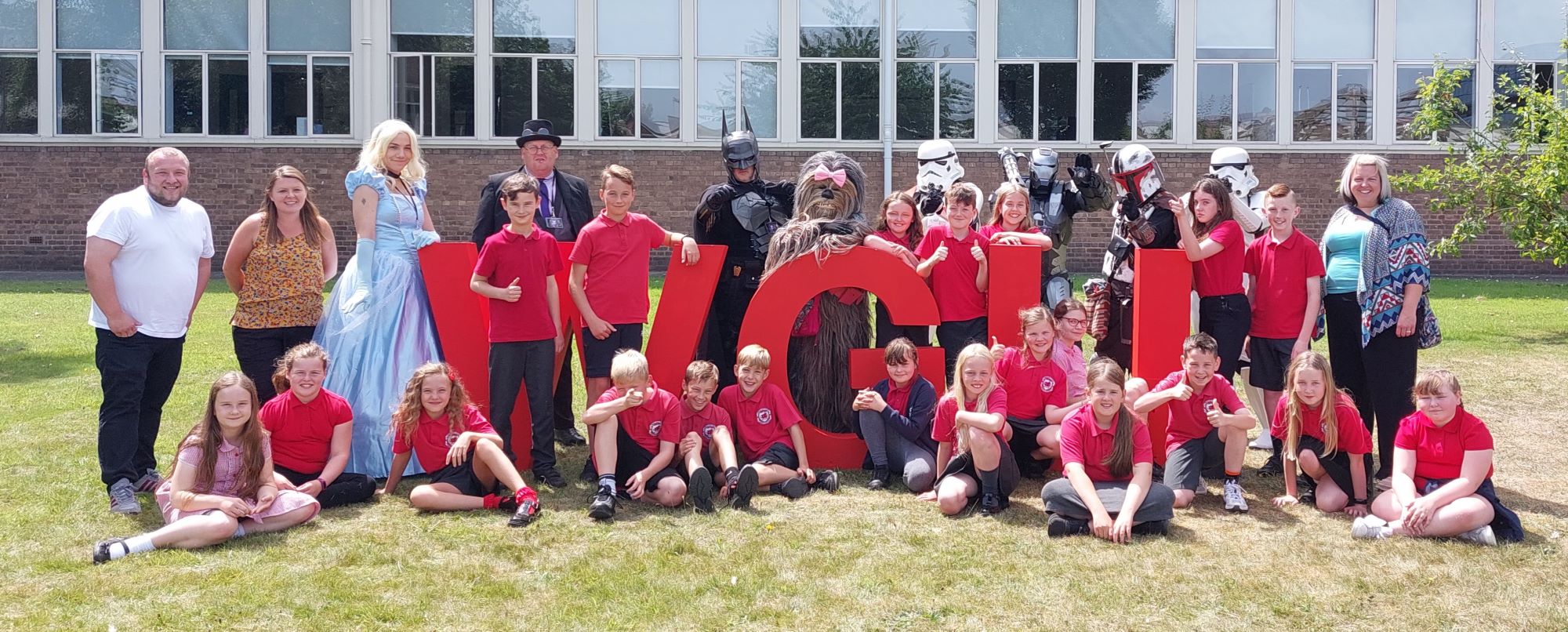 Group picture of children and cosplayers