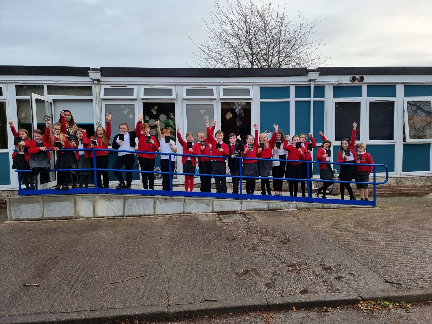 Pupils from Bodhyfryd standing outside their classroom
