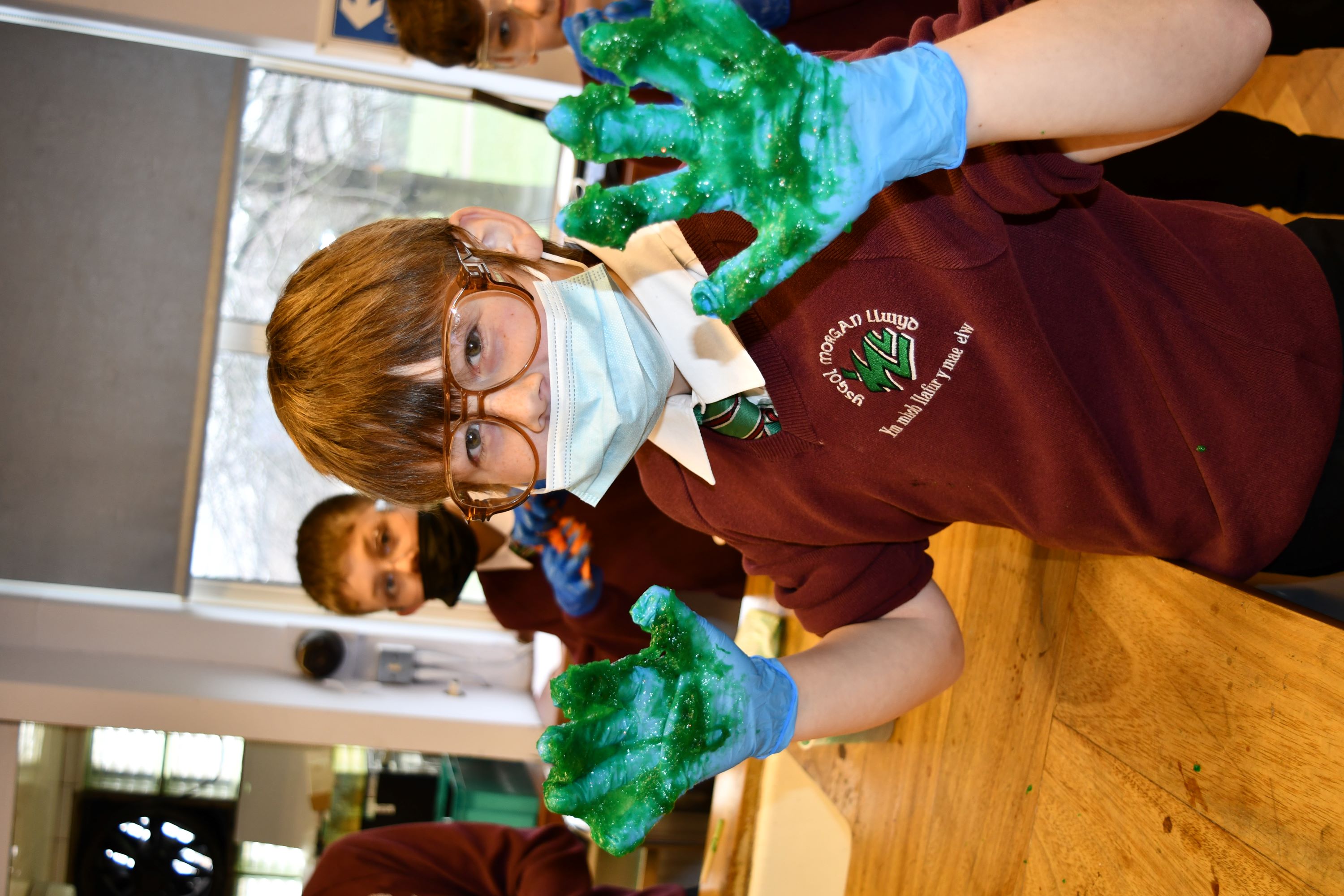 Boy with slime on his hands