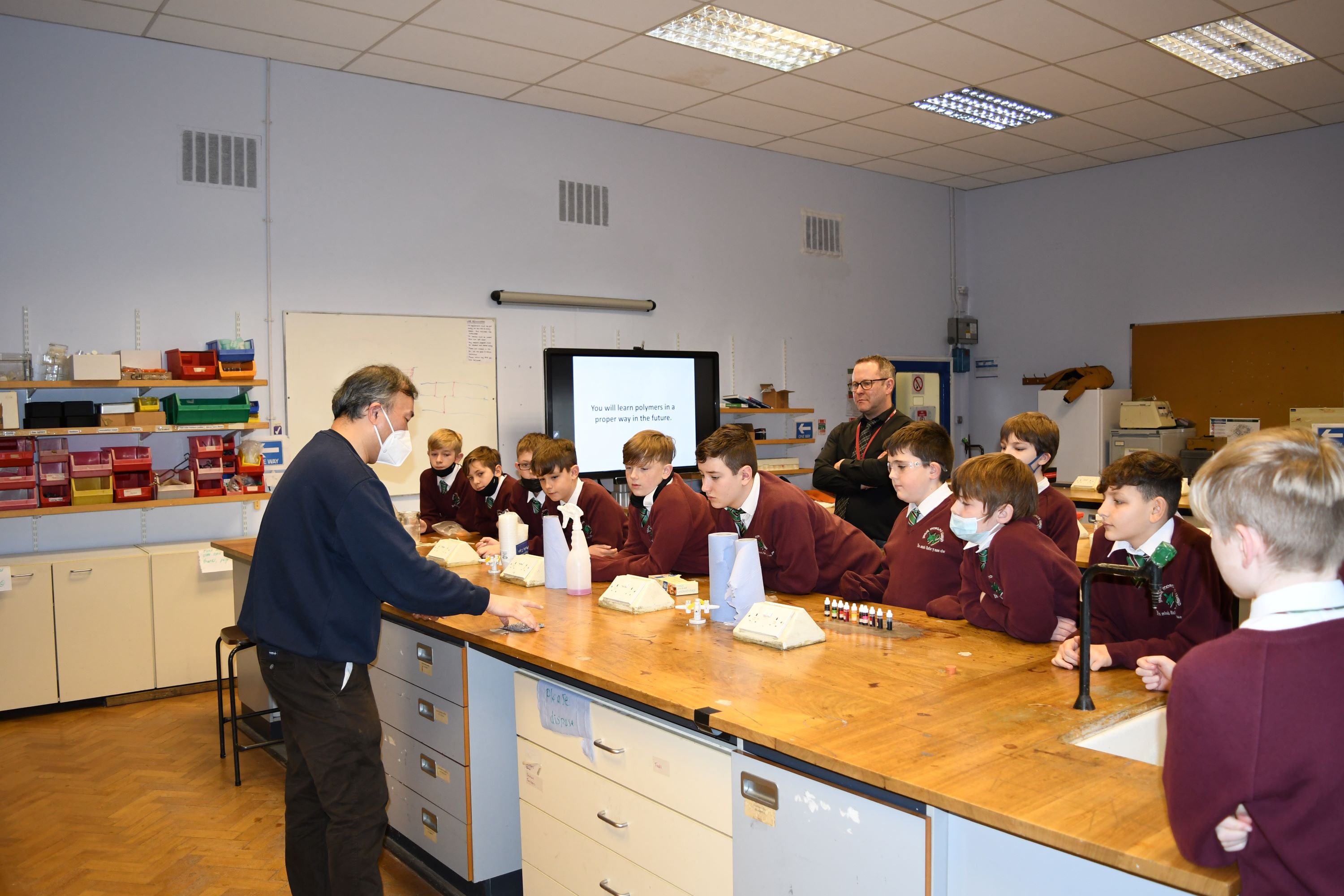 Boys watching a slime demonstration