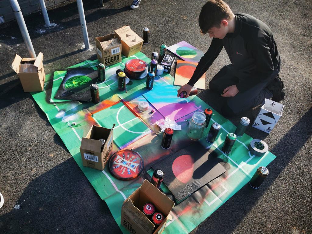 Teenager spray painting