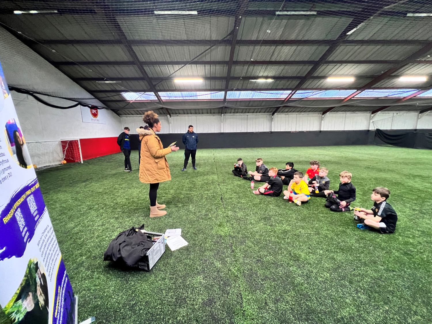 Nat talking to footballers