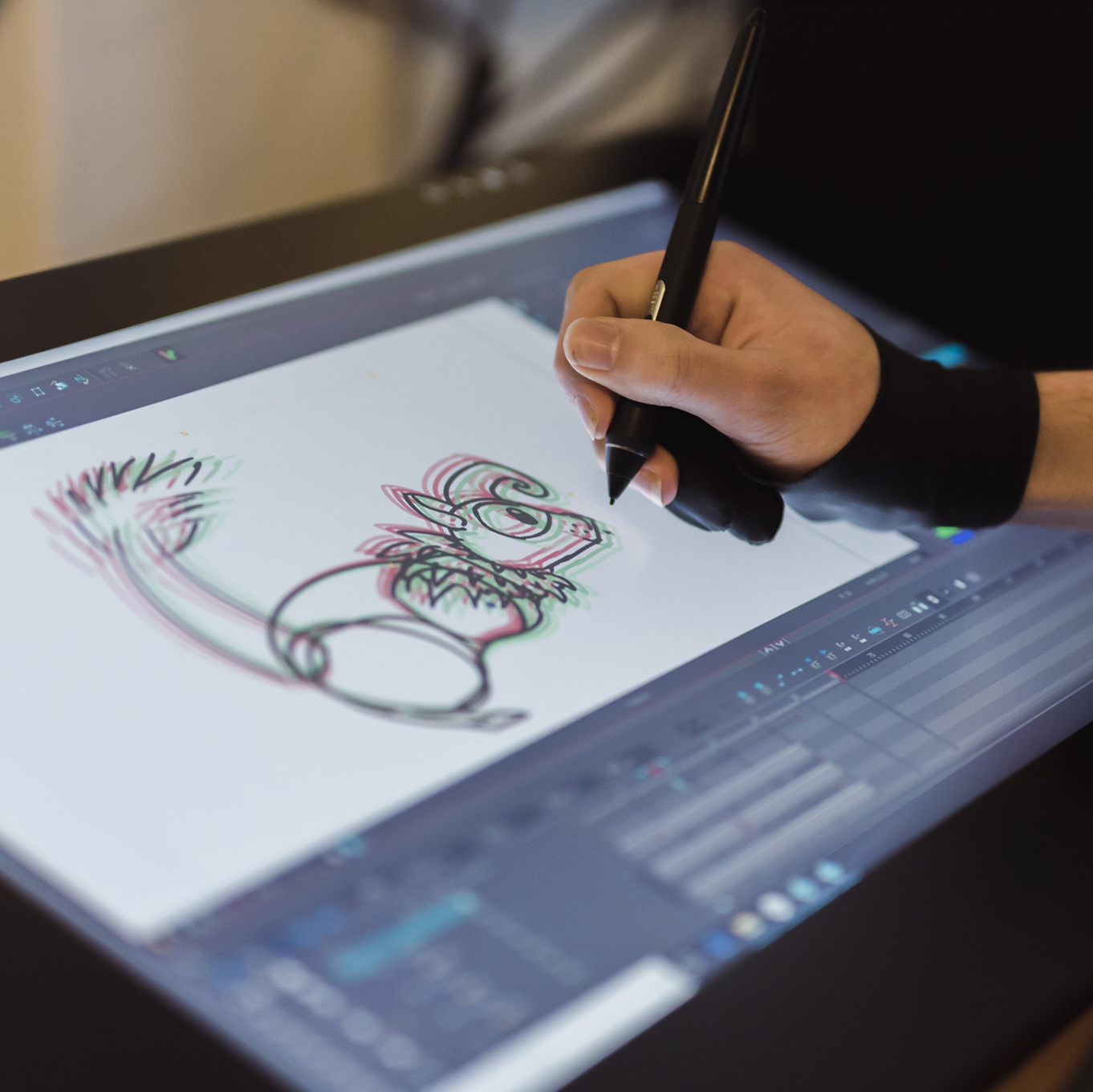A student draws out their art concept on a tablet