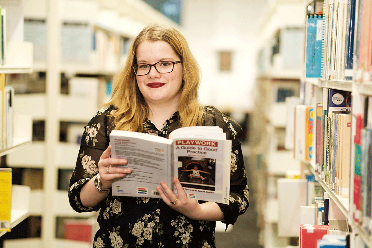 Lady holding a book