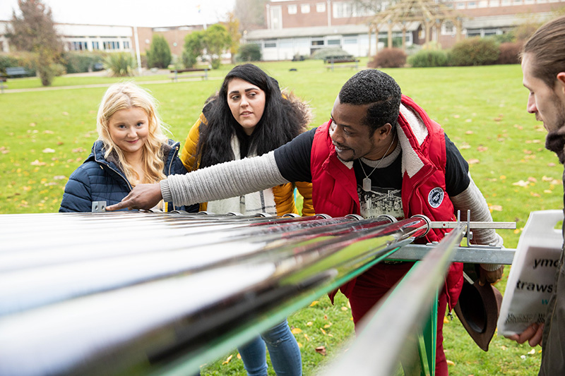 Renewable engineering students with solar panels