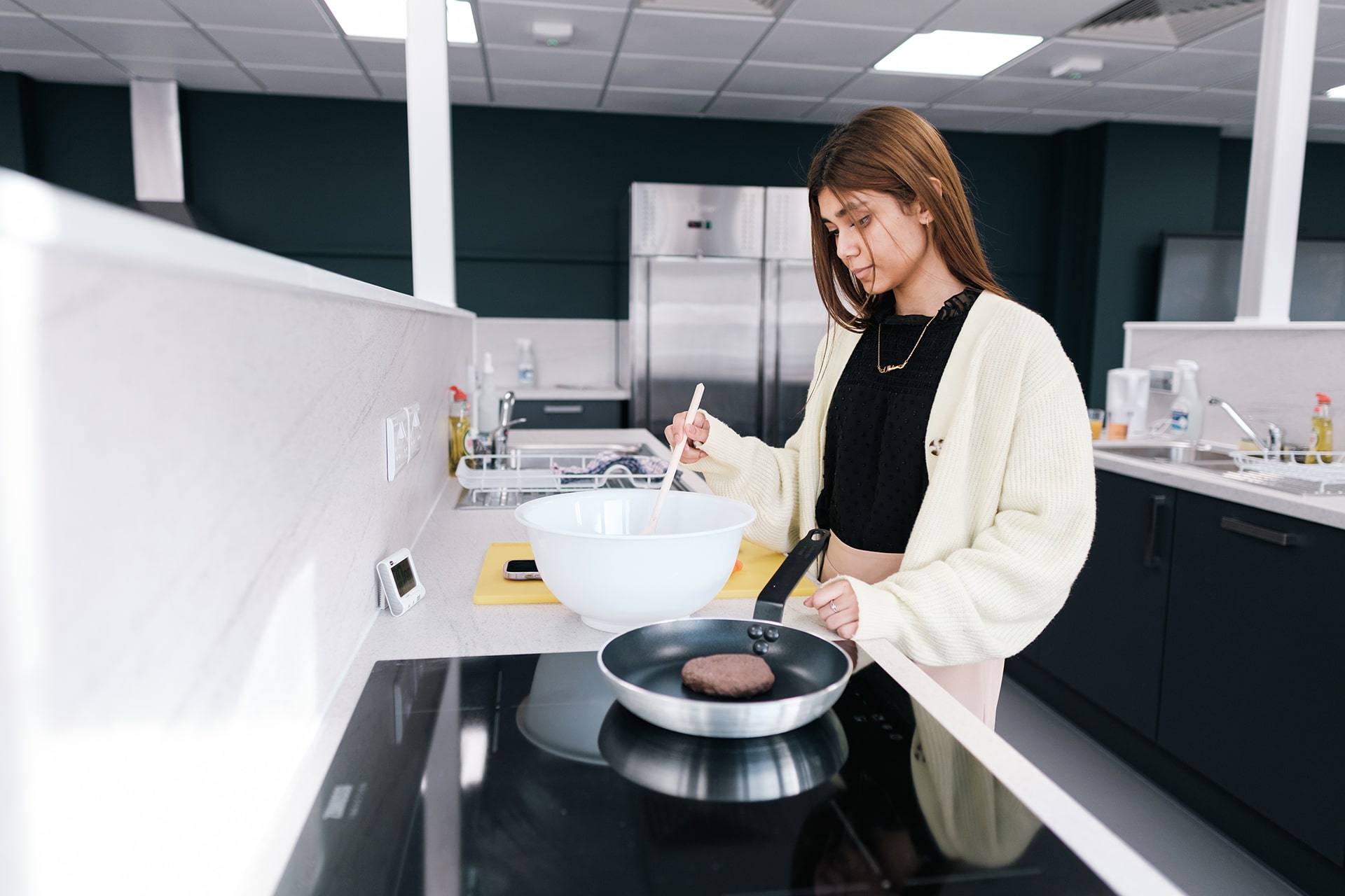 Student using the Nutrition and Dietetics Kitchen