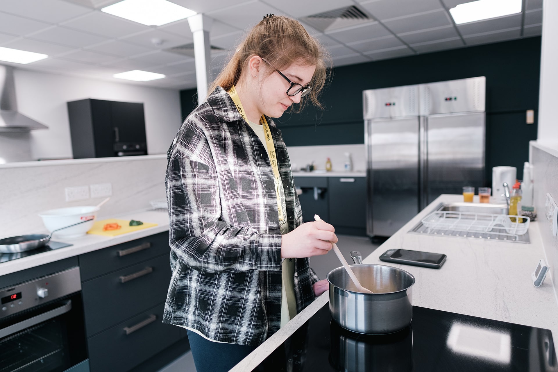 Student stirring a pan