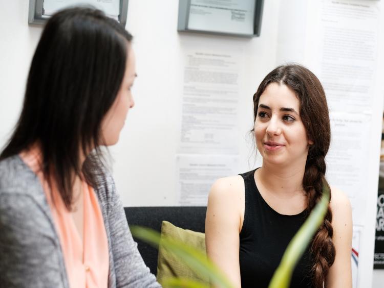 Two students talking to each other