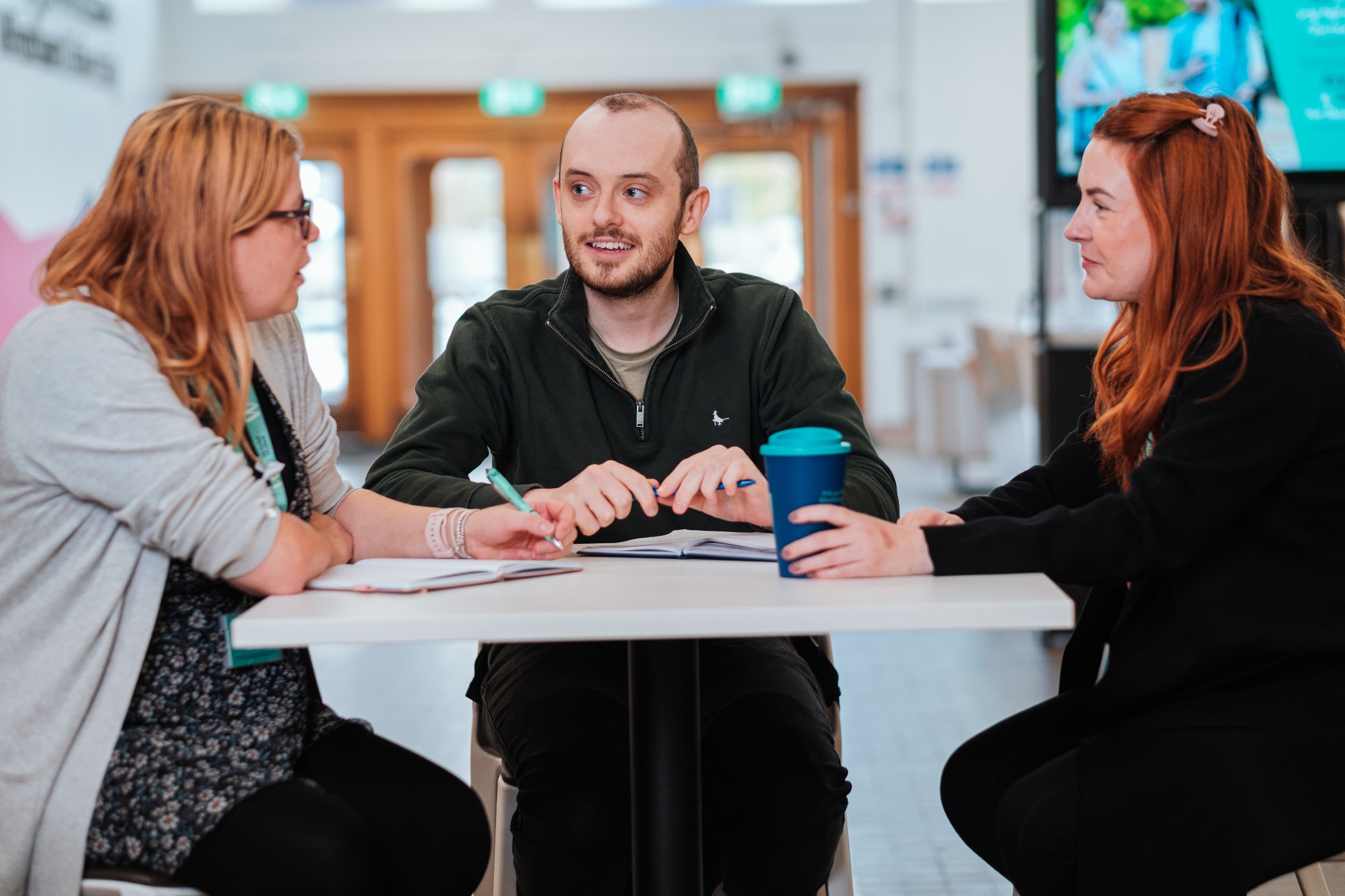 Postgraduate students talking