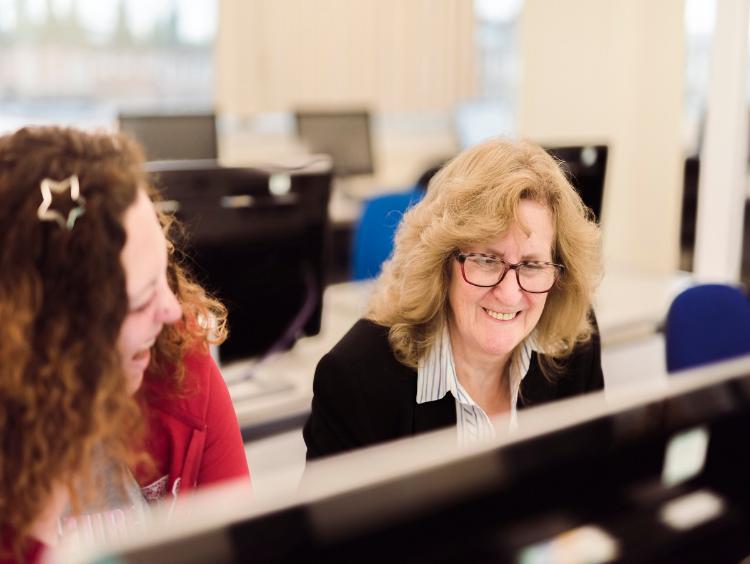 mature student looking at pc screen