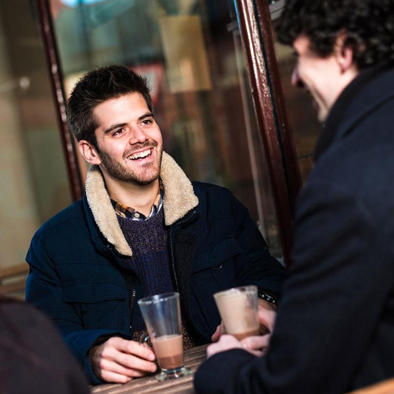 A group sitting outside a wrexham cafe