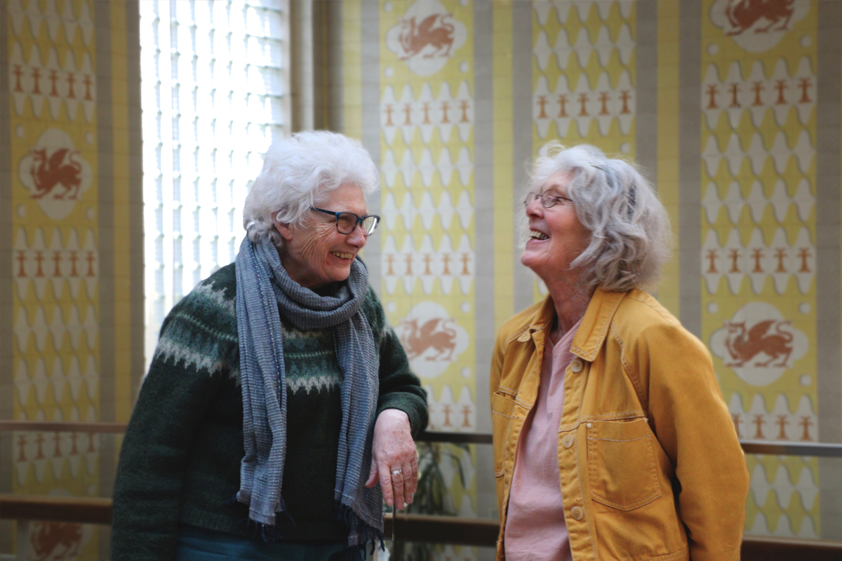 Two elderly students on campus