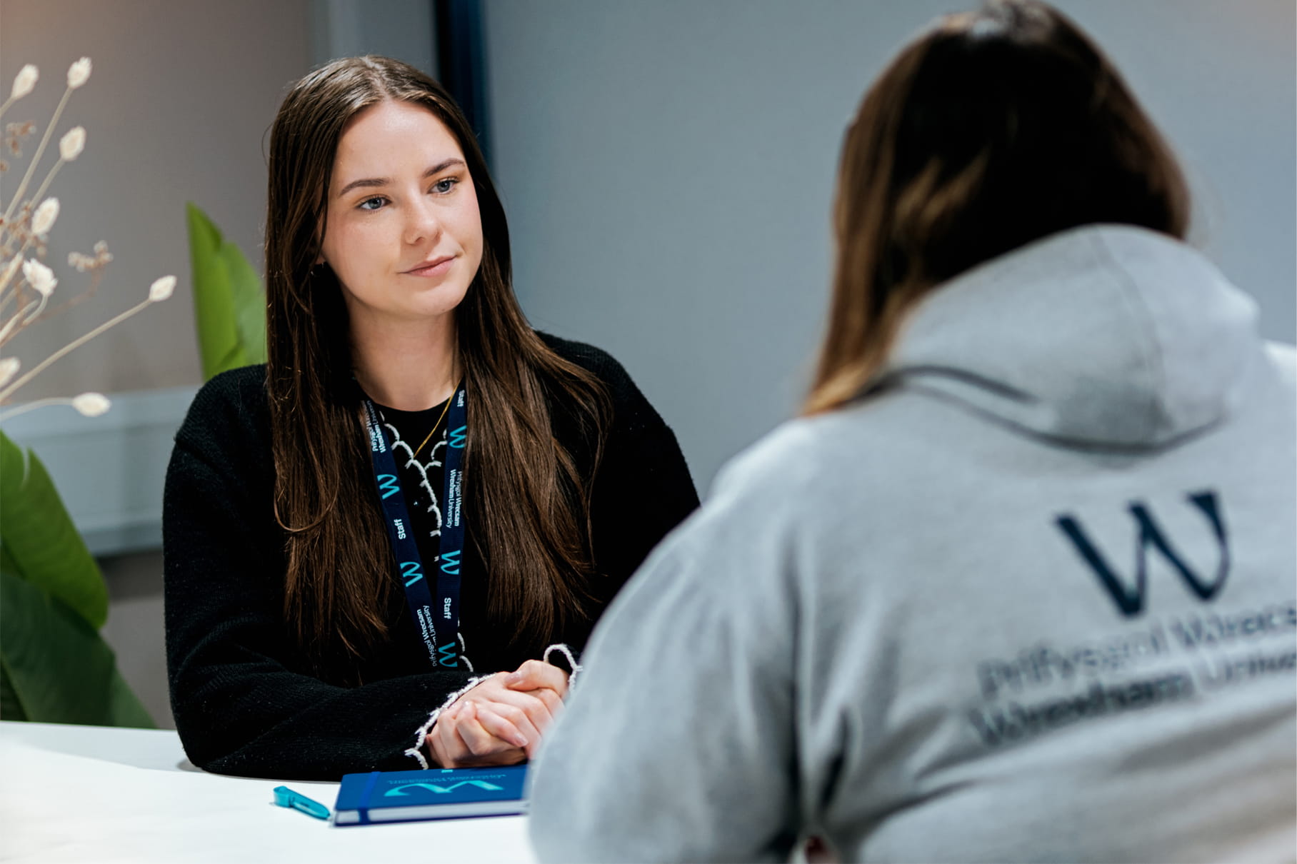 Staff counselling a student