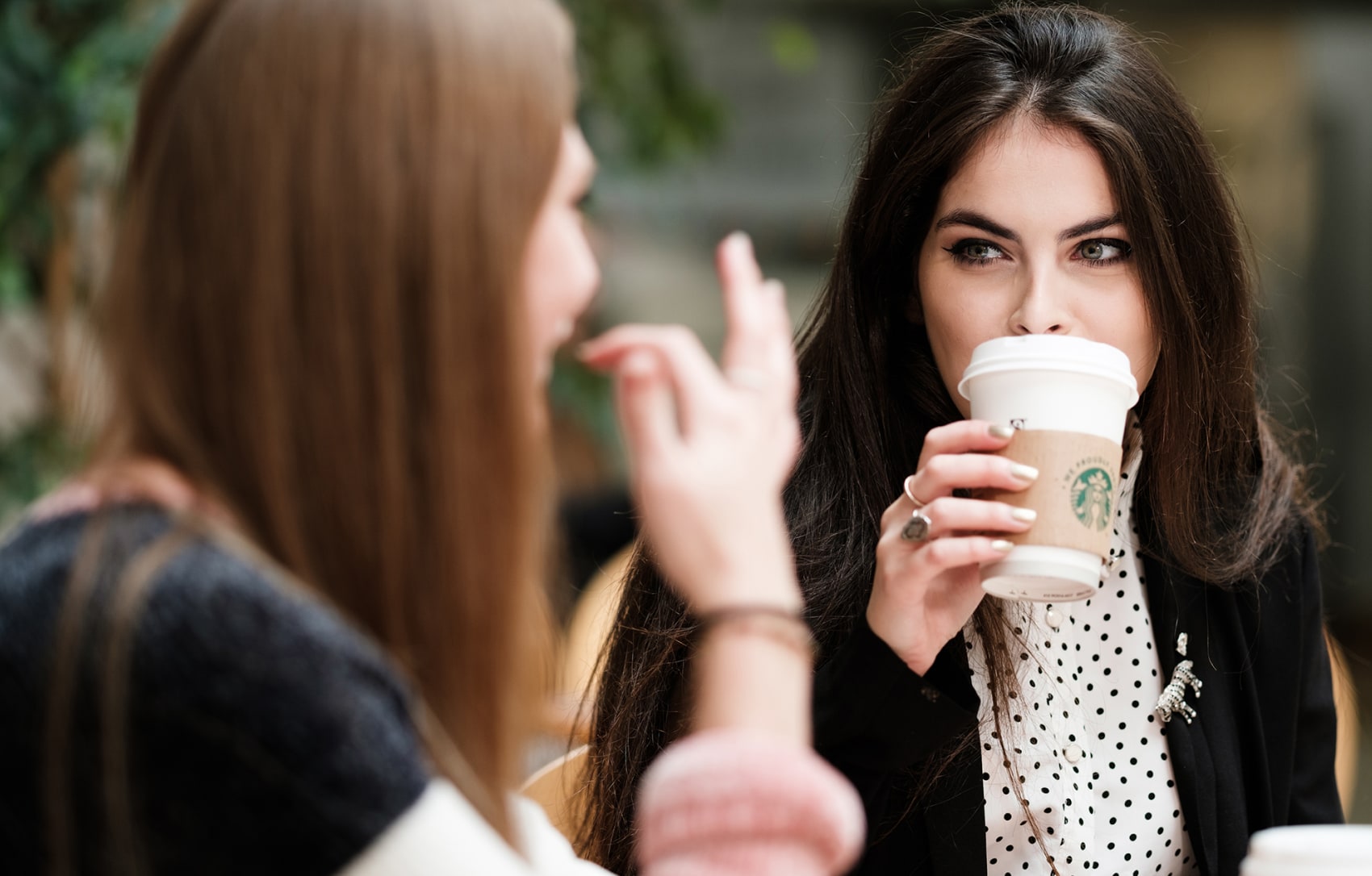 Student drinking from a Starbucks cup