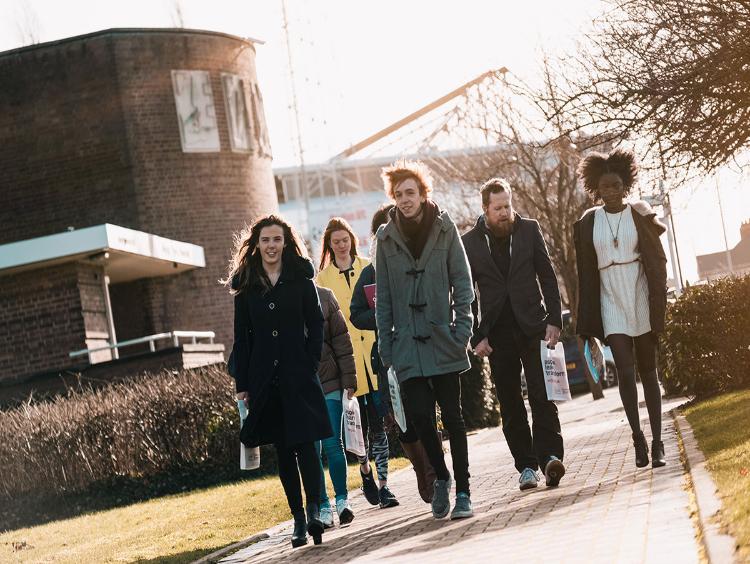 A group of students walking outside campus