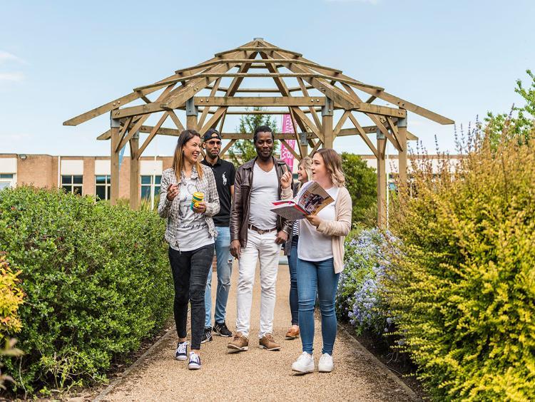 A group of students walking outside campus