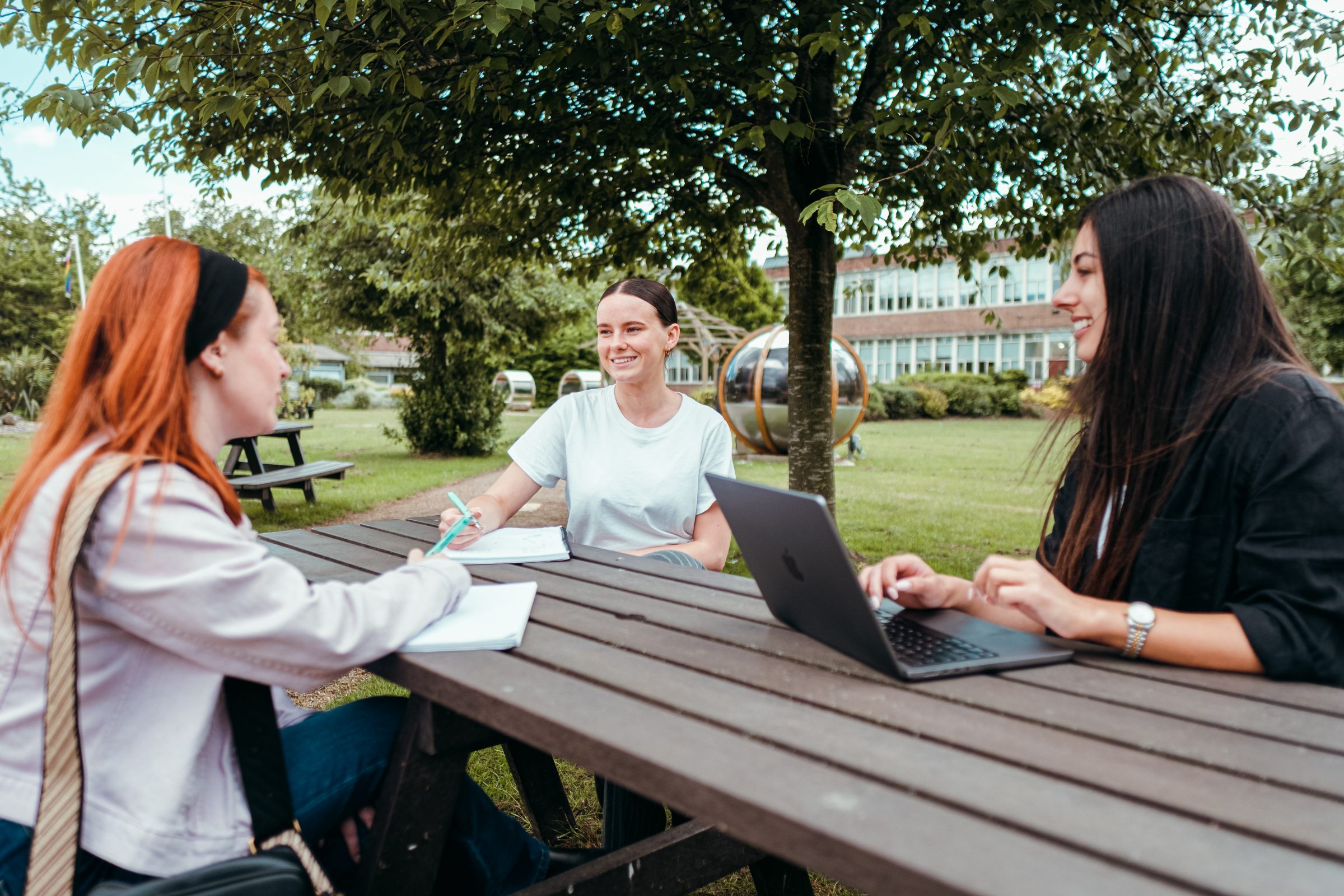 Undergraduate students chatting outside