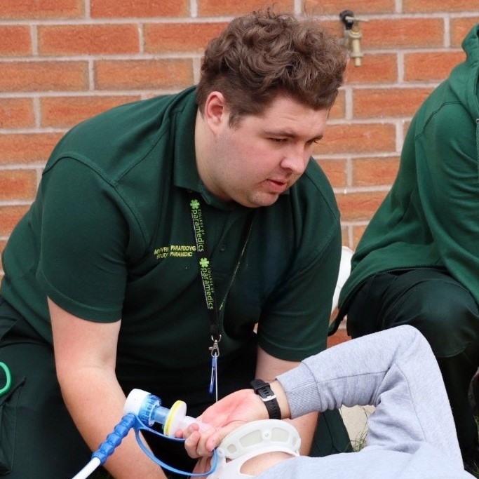 Student paramedic treating patient
