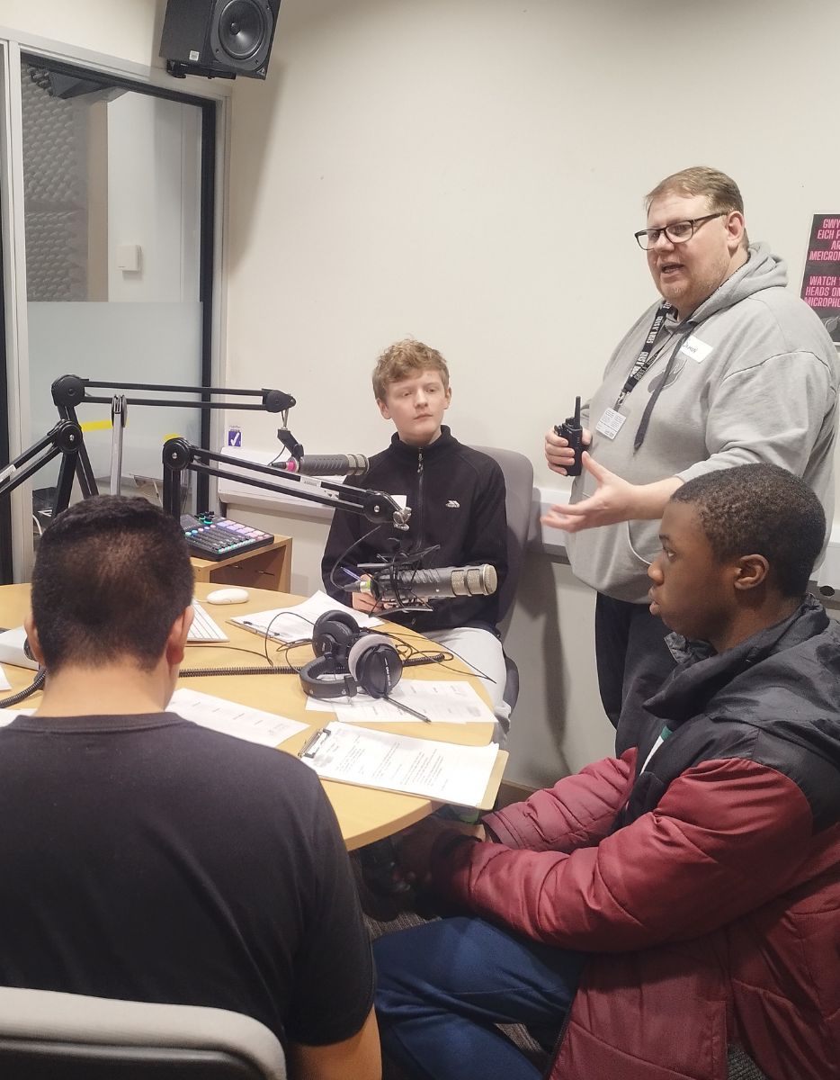 Students recording a podcast