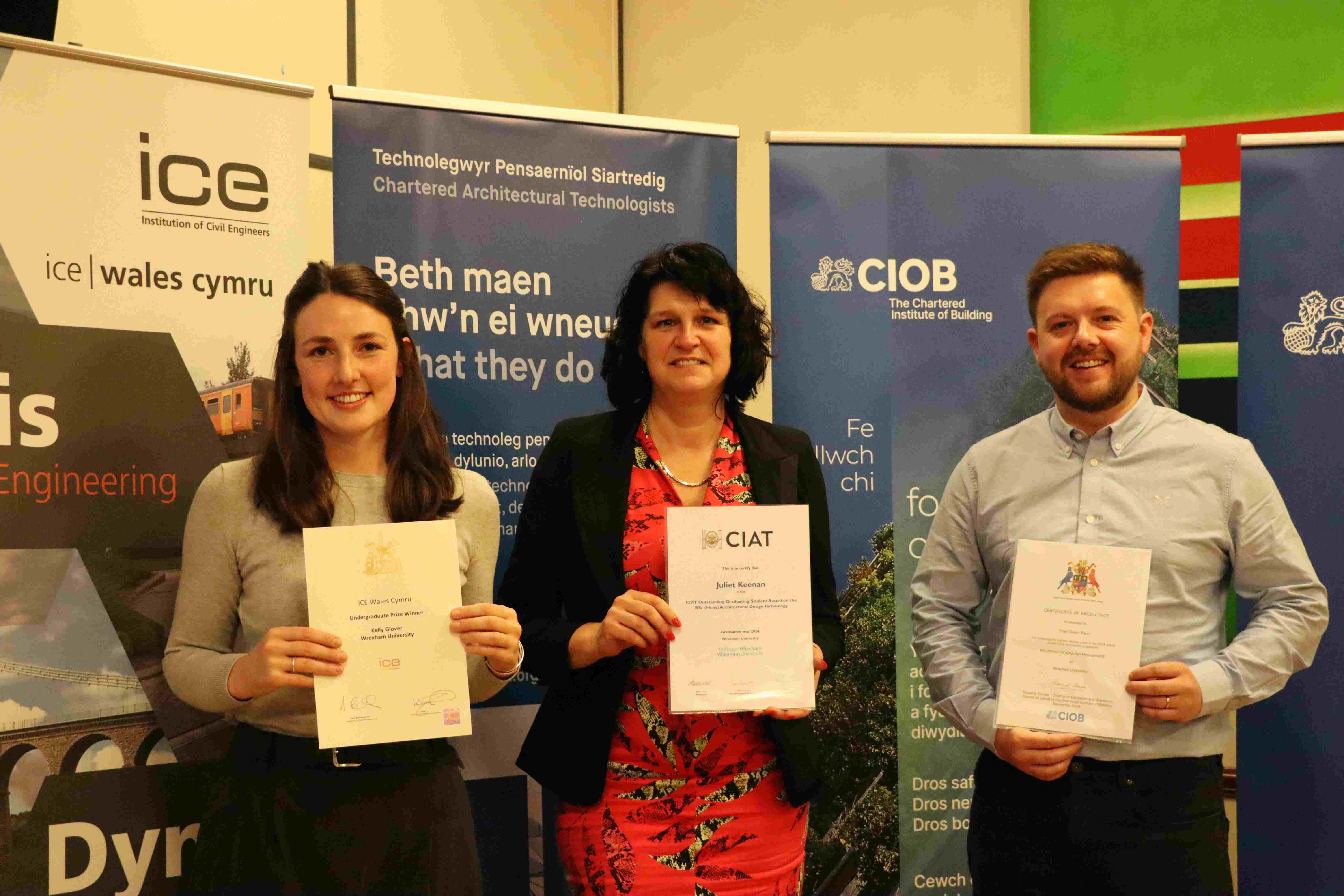 Three Built Environment graduates with certificates