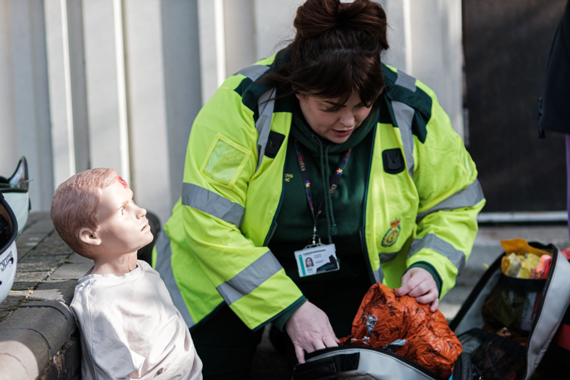 Student paramedic treating a medical manikin