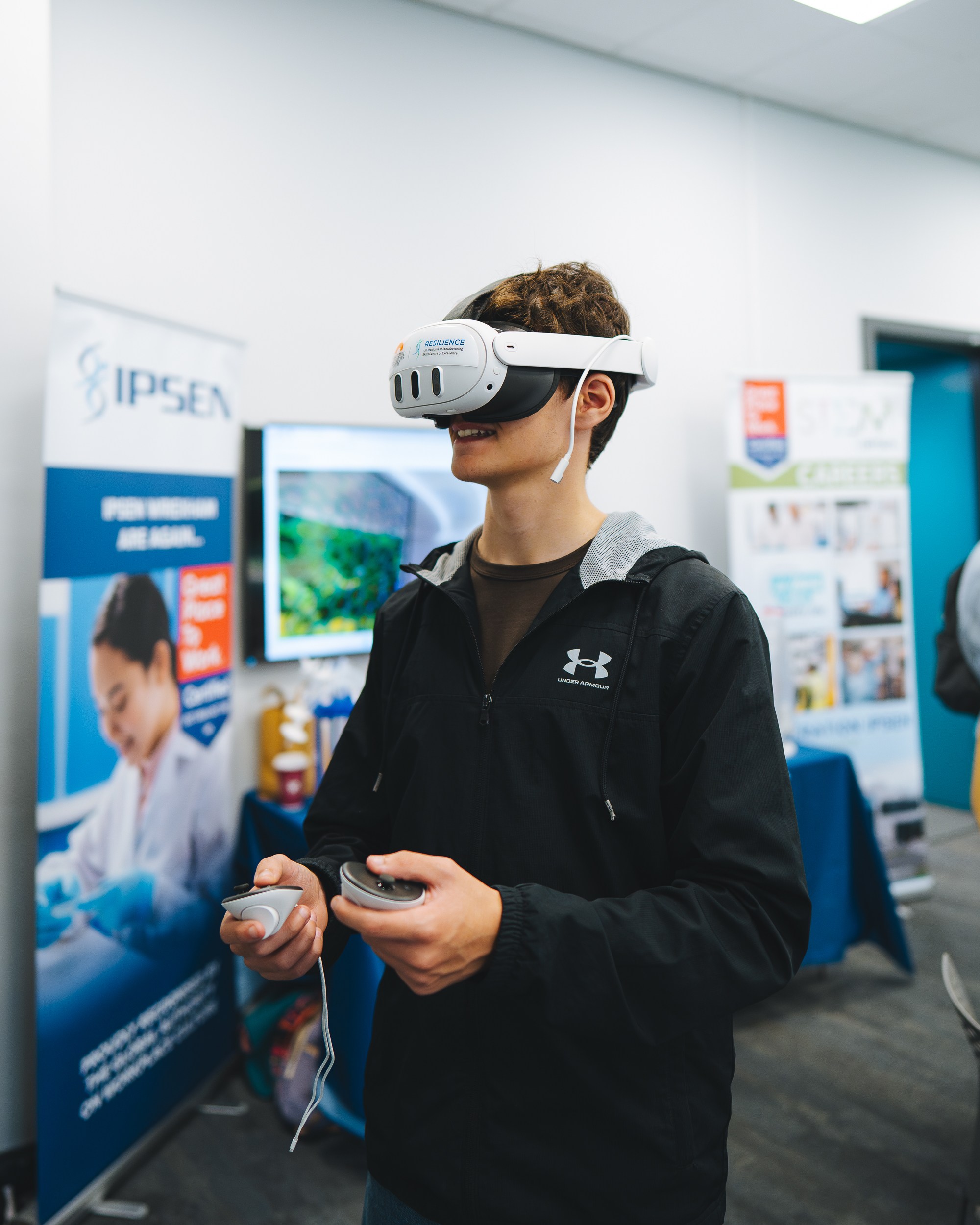 Student tries our virtual reality headset at Wrexham University