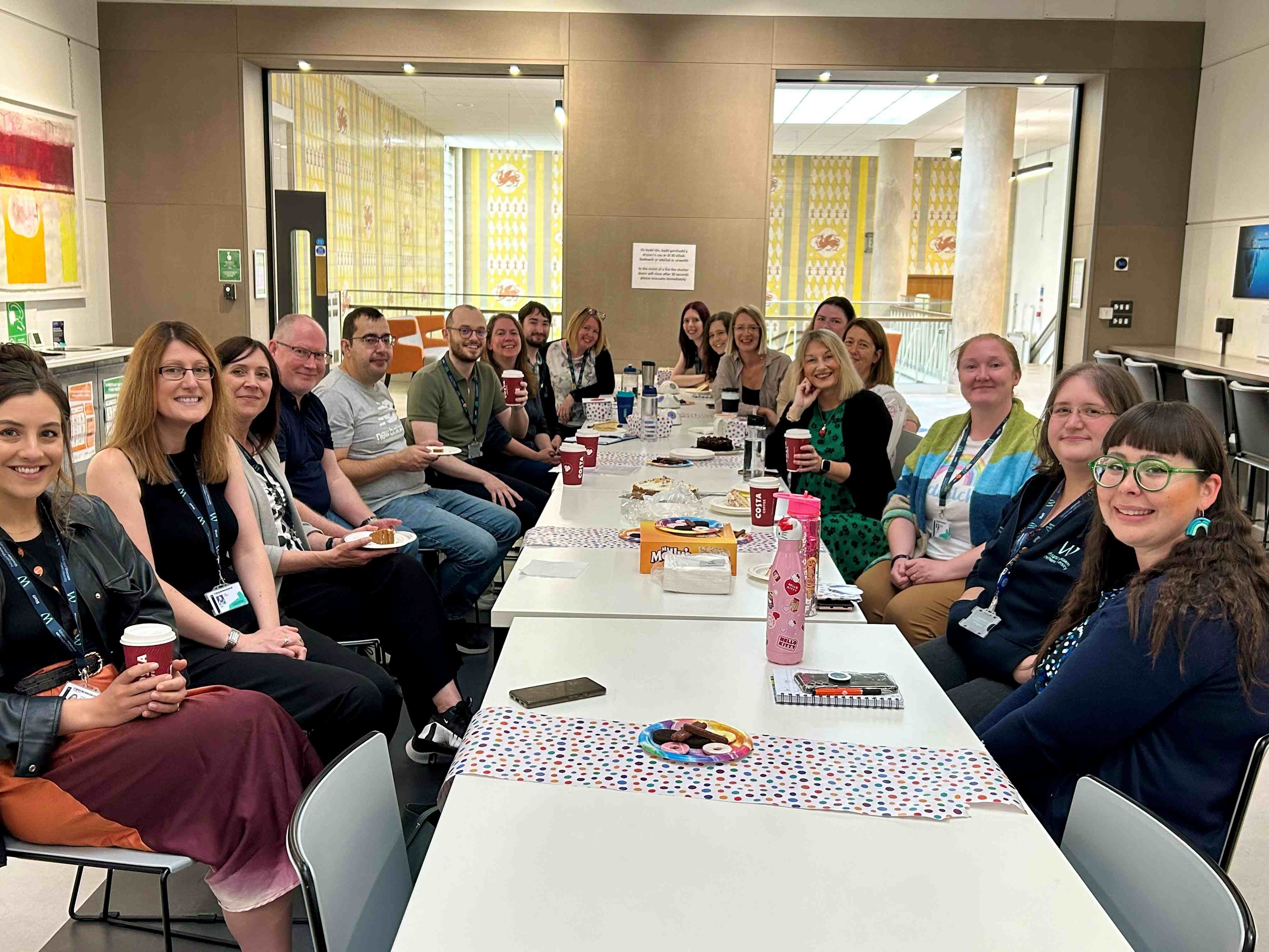 Group of Welsh language learners sat around a table