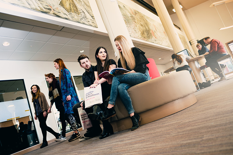 A group sitting with open day prospectuses