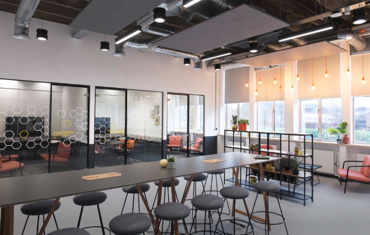 A communal area with tables and chairs
