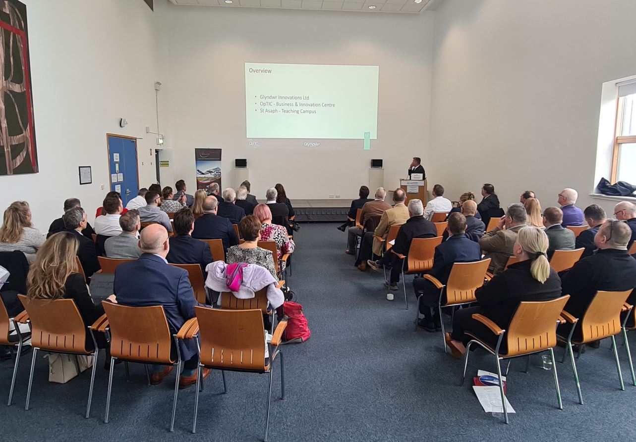 People sat watching a presentation