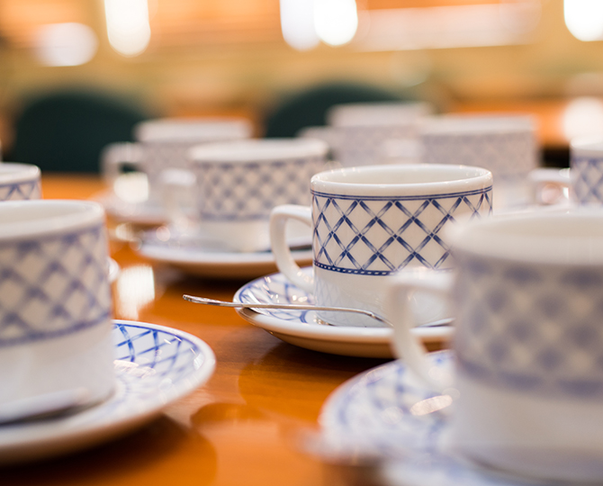 Cups and saucers arranged on a table