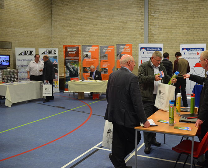 Exhibition stands set up in a large sports hall