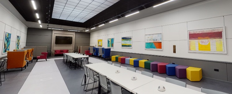 A study room with tables and chairs