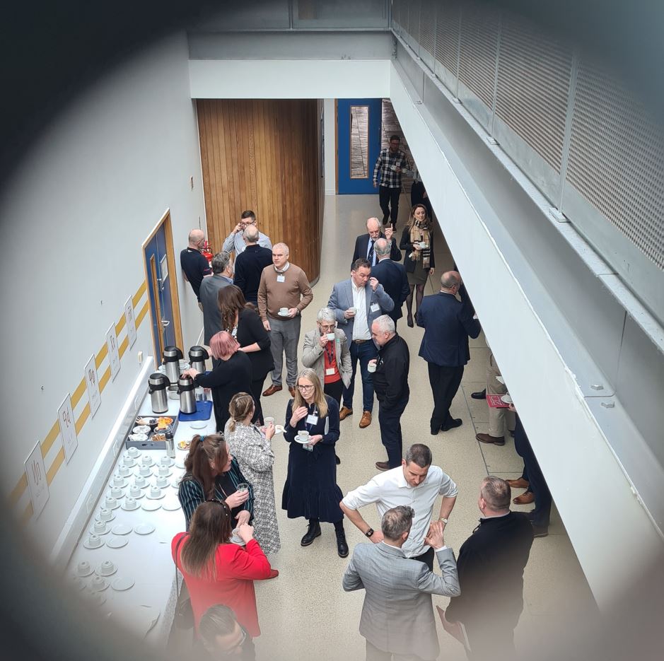 A group of people networking in an exhibition area