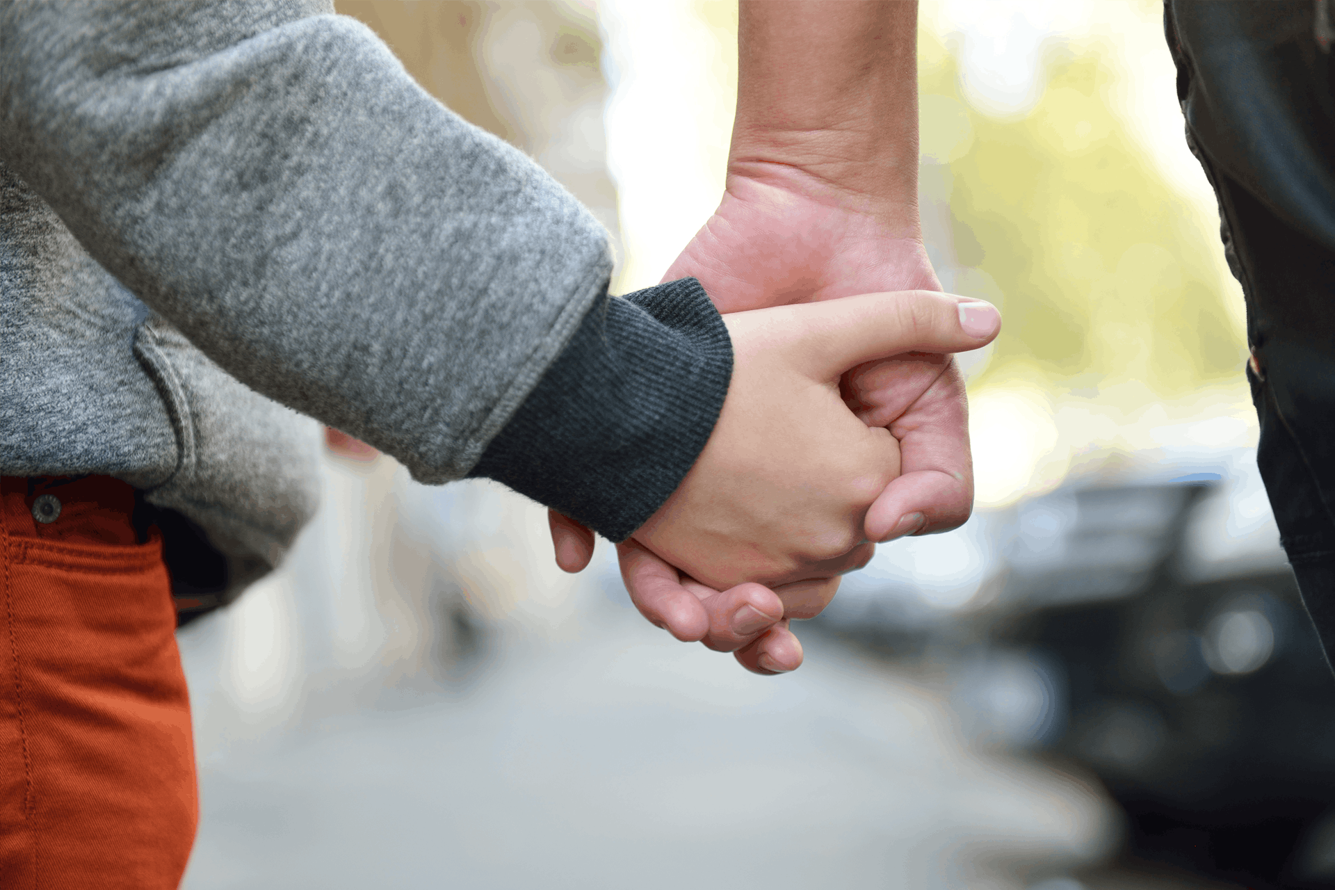 Parent and child holding hands