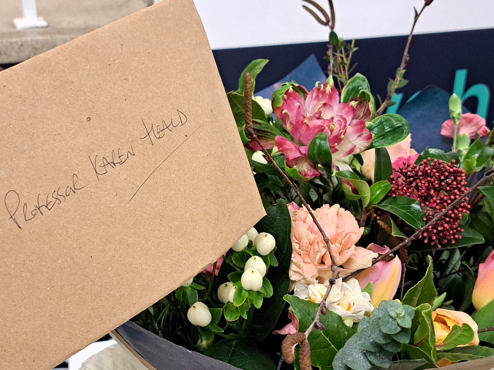Bunch of flowers with a card addressed to Prof Karen Heald