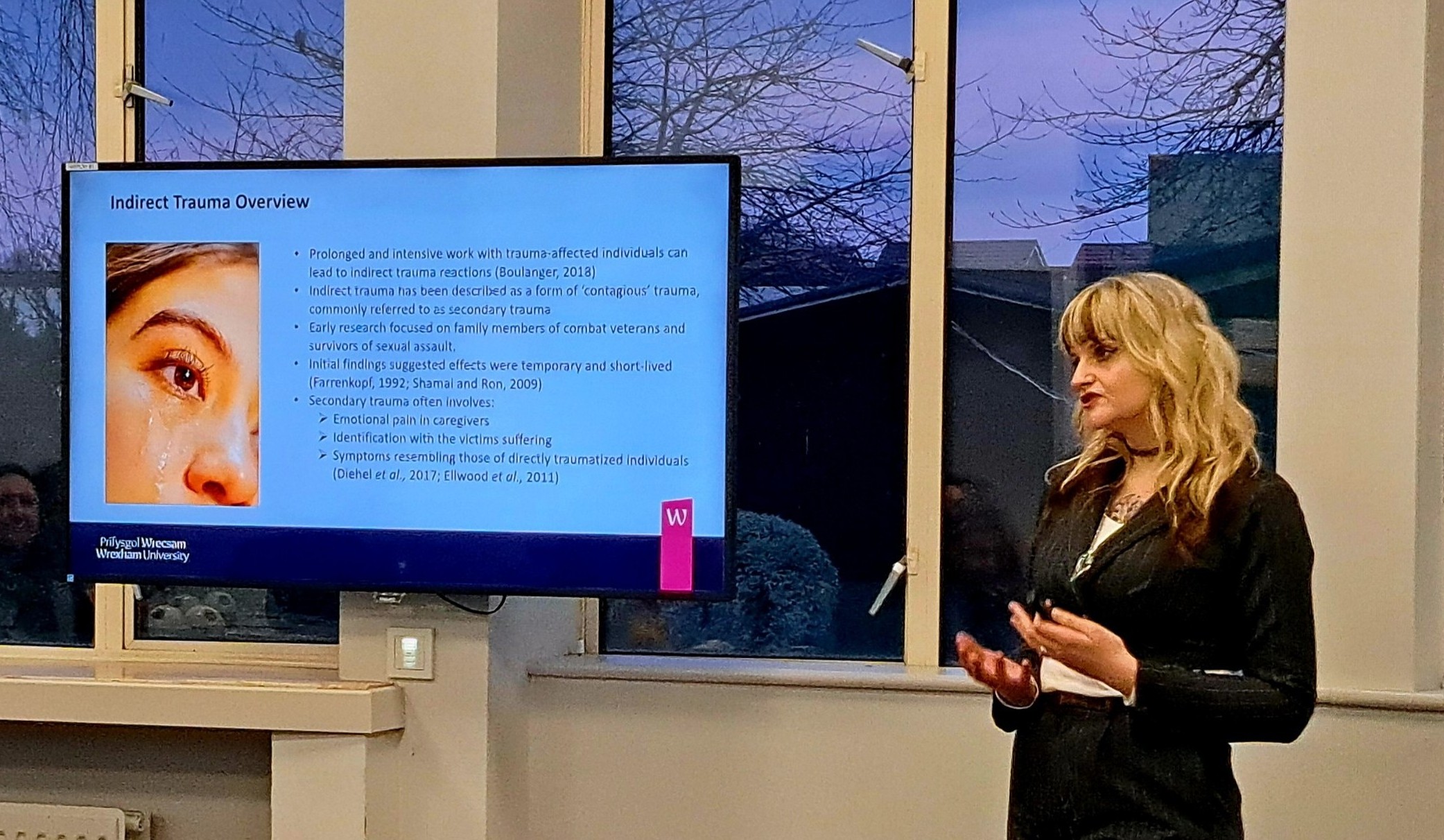 tegan presenting in front of a screen