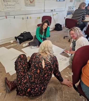 karen on the floor with attendees