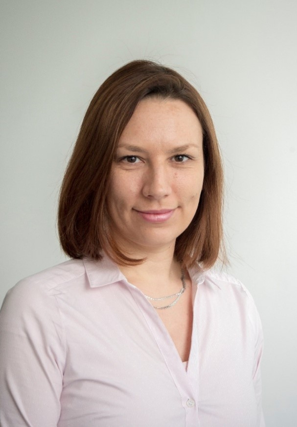 Head and shoulders image of a researcher in a white shirt