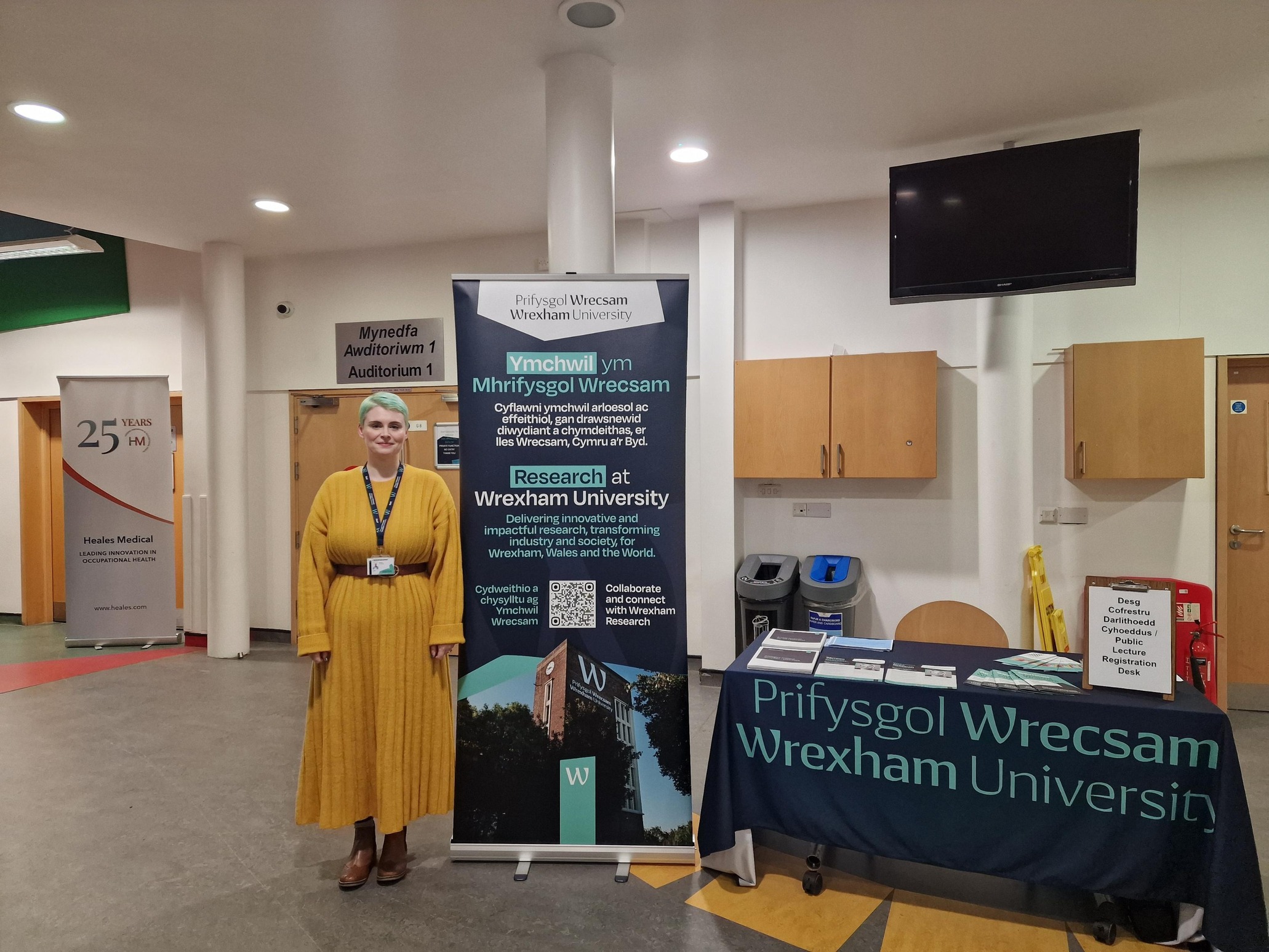 Person standing near an advertising banner