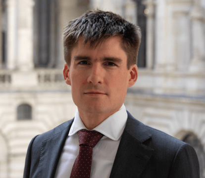 Headshot of a man in a suit