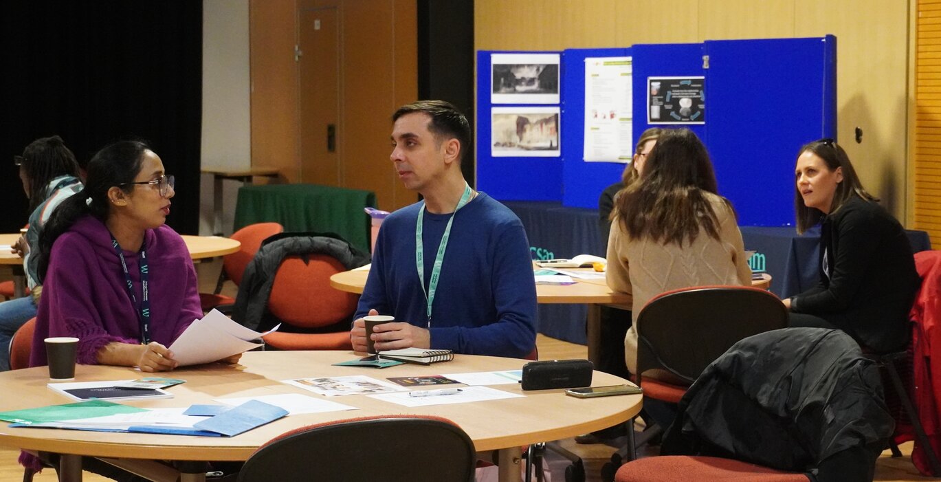 students conversing at PGR conference