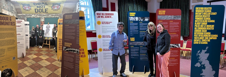 attendees near the stands at the exhibition